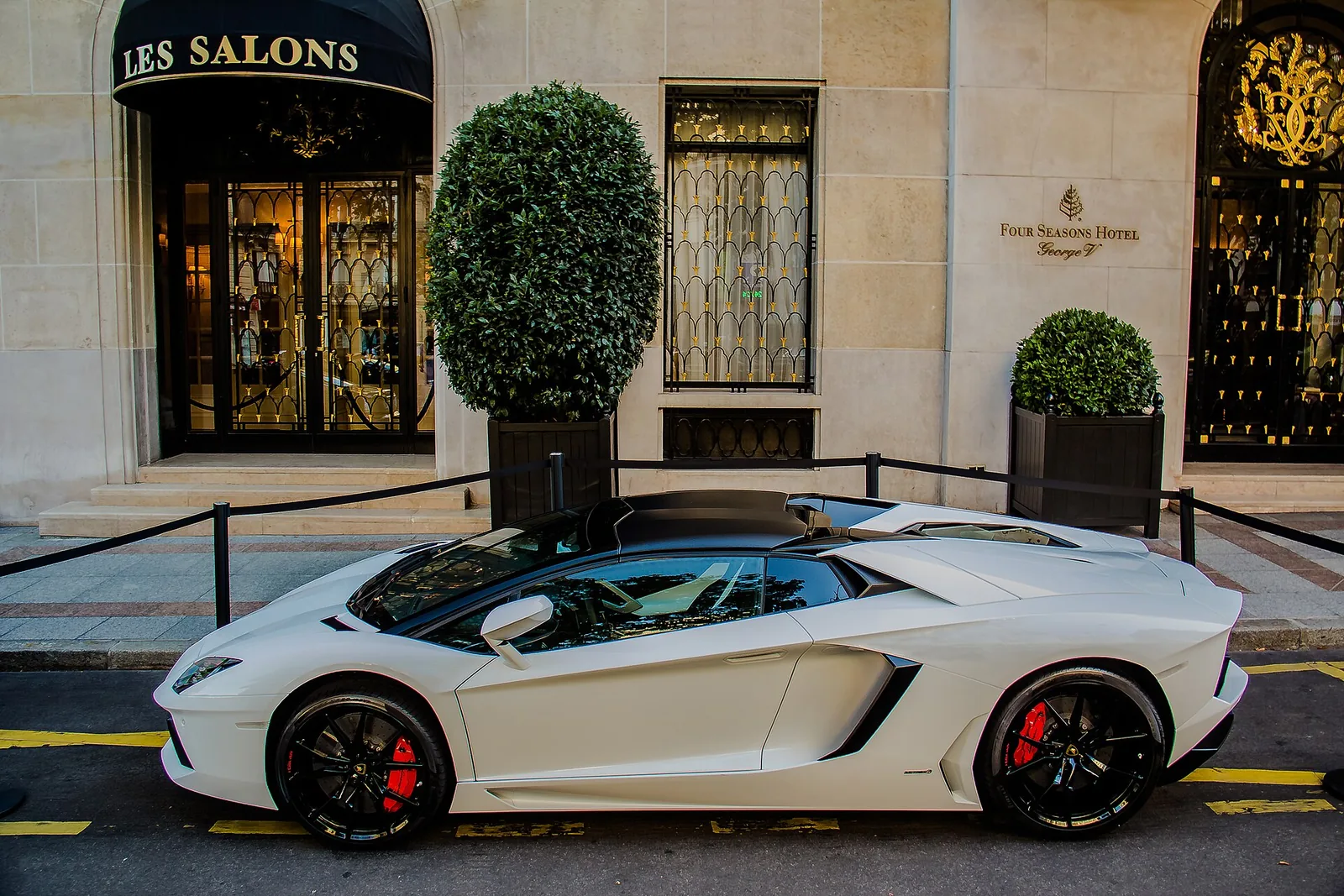 Lamborghini Aventador LP 700-4 Roadster in white, near-side view with the roof panels removed