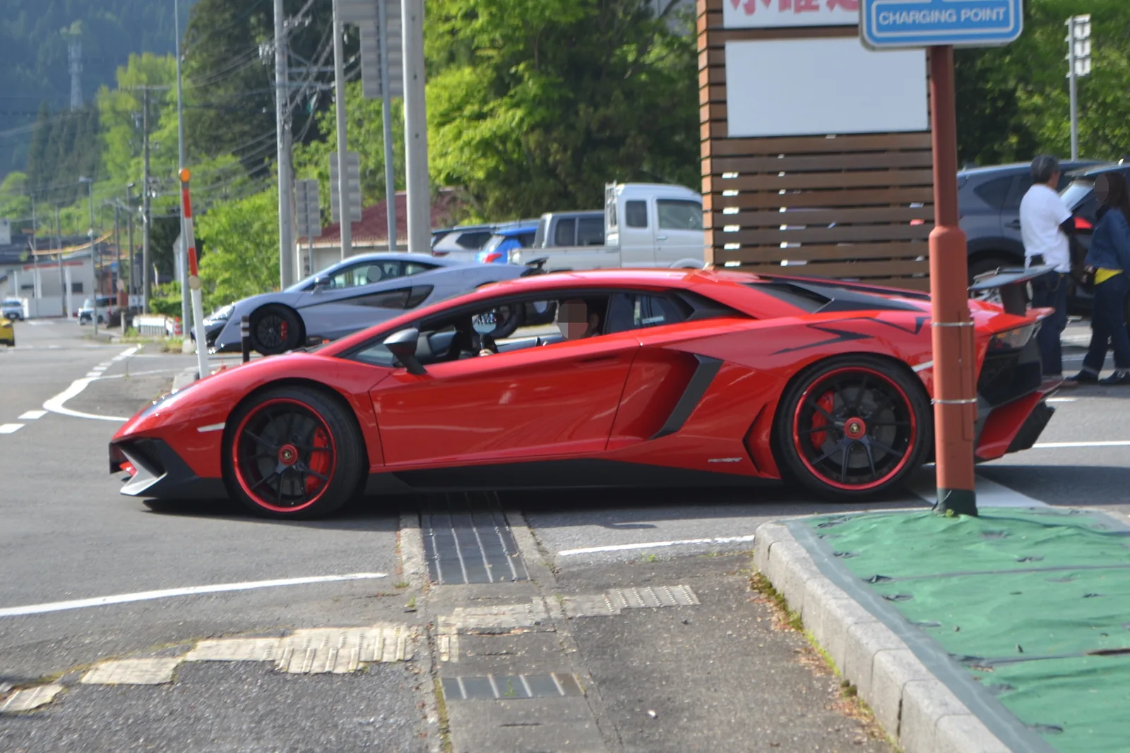 Lamborghini Aventador LP 750-4 Superveloce side profile in red with the fixed carbon rear wing