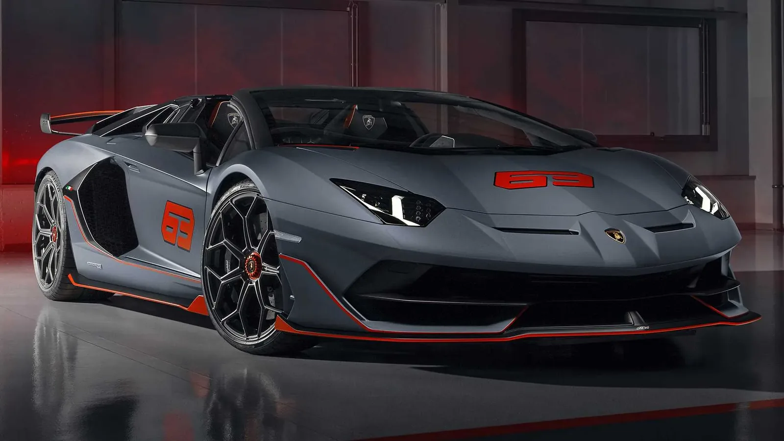 Lamborghini Aventador SVJ 63 Roadster side view in dark grey with exposed carbon-fibre bodywork