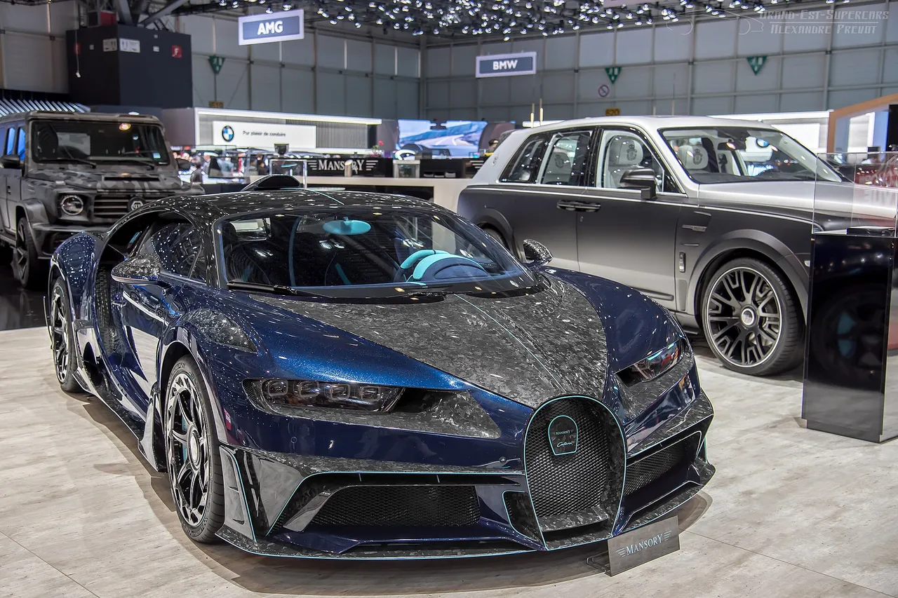 Blue and exposed-carbon Mansory Centuria Bugatti Chiron at the 2019 Geneva Motor Show, front three-quarter view