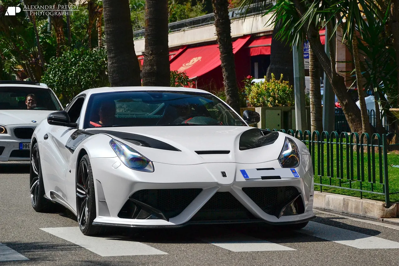 White Ferrari F12berlinetta Mansory Stallone with carbon details, front three-quarter view