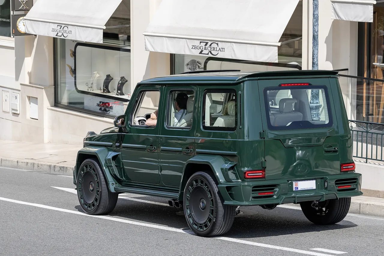 Green Mercedes-AMG G 63 Mansory P720 Performance parked on a street, front three-quarter view