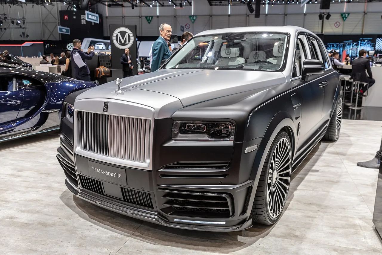 Two-tone silver and black Mansory Rolls-Royce Cullinan with carbon front bumper at the 2019 Geneva Motor Show