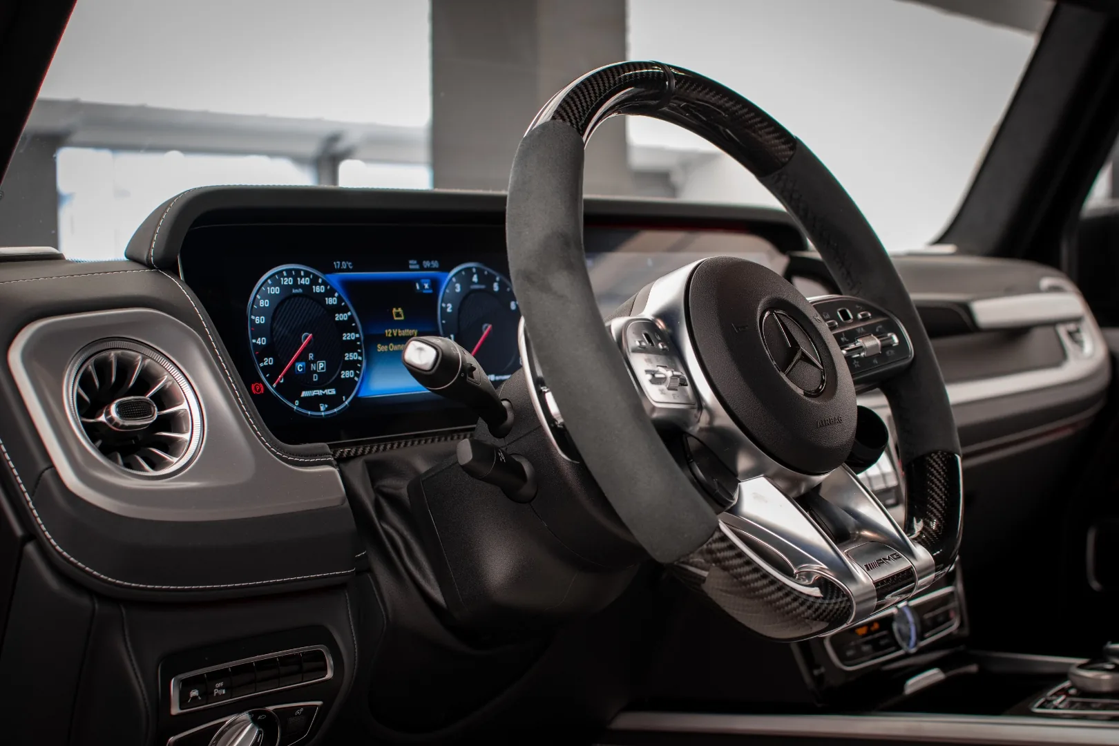 Mercedes-AMG G63 4x4² interior cockpit with carbon steering wheel and digital instruments