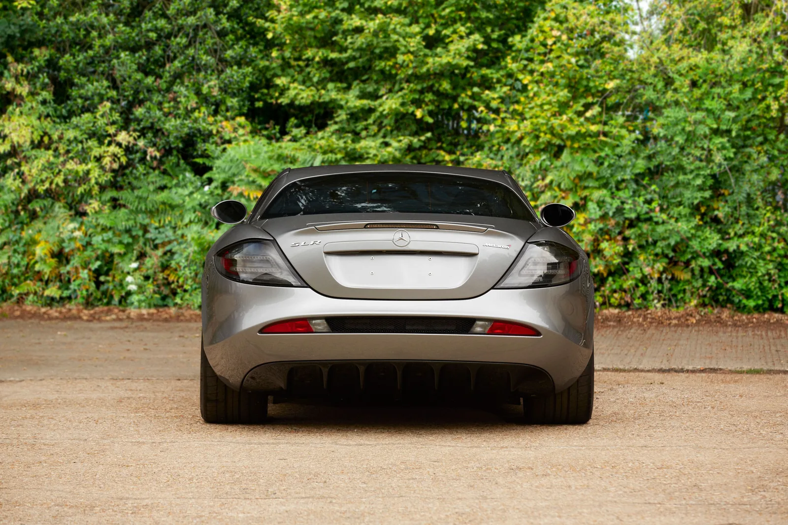 Rear view of a silver Mercedes-Benz SLR McLaren 722 Edition with rear diffuser and twin tail lights