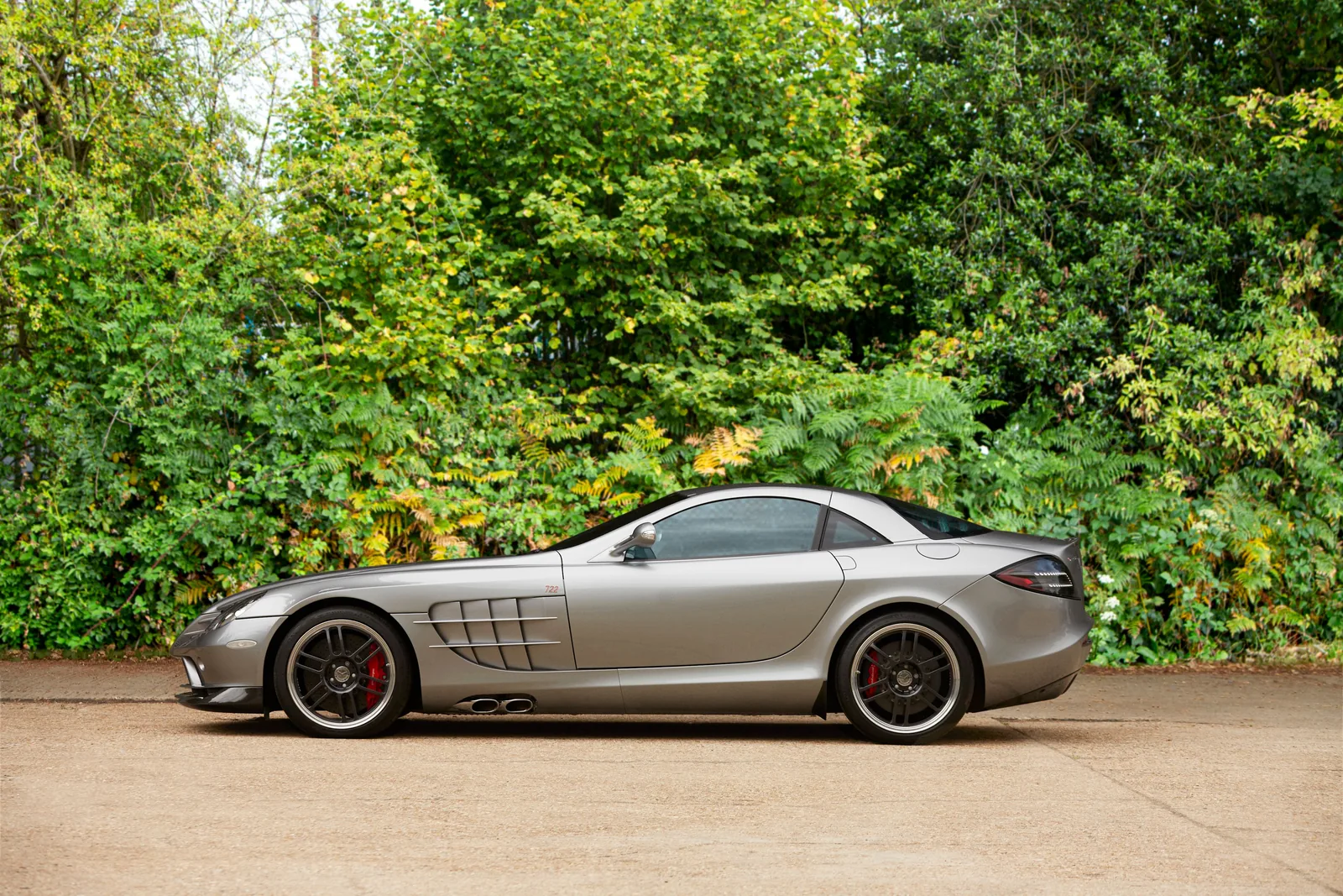 Silver Mercedes-Benz SLR McLaren 722 Edition side profile showing the long bonnet, side exhausts and 722 badge on the flank