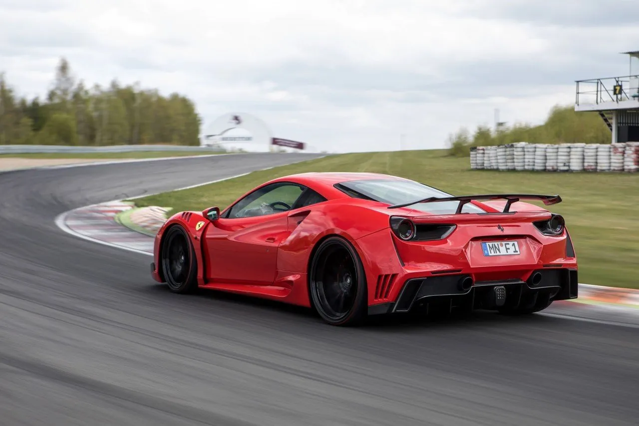 Red Novitec Ferrari 488 N-Largo on a race track, rear three-quarter view with large rear wing