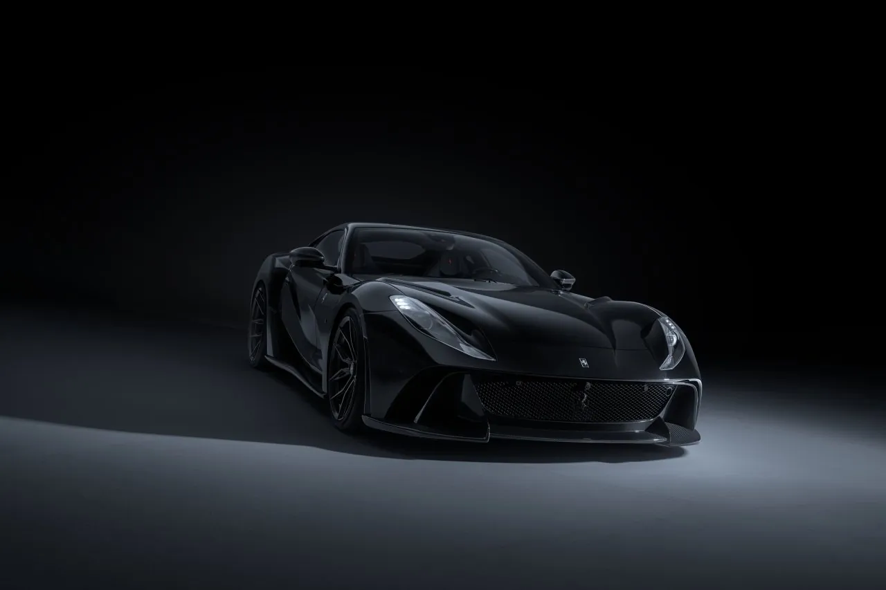 Black Novitec Ferrari 812 N-Largo S in a dark studio, front three-quarter view