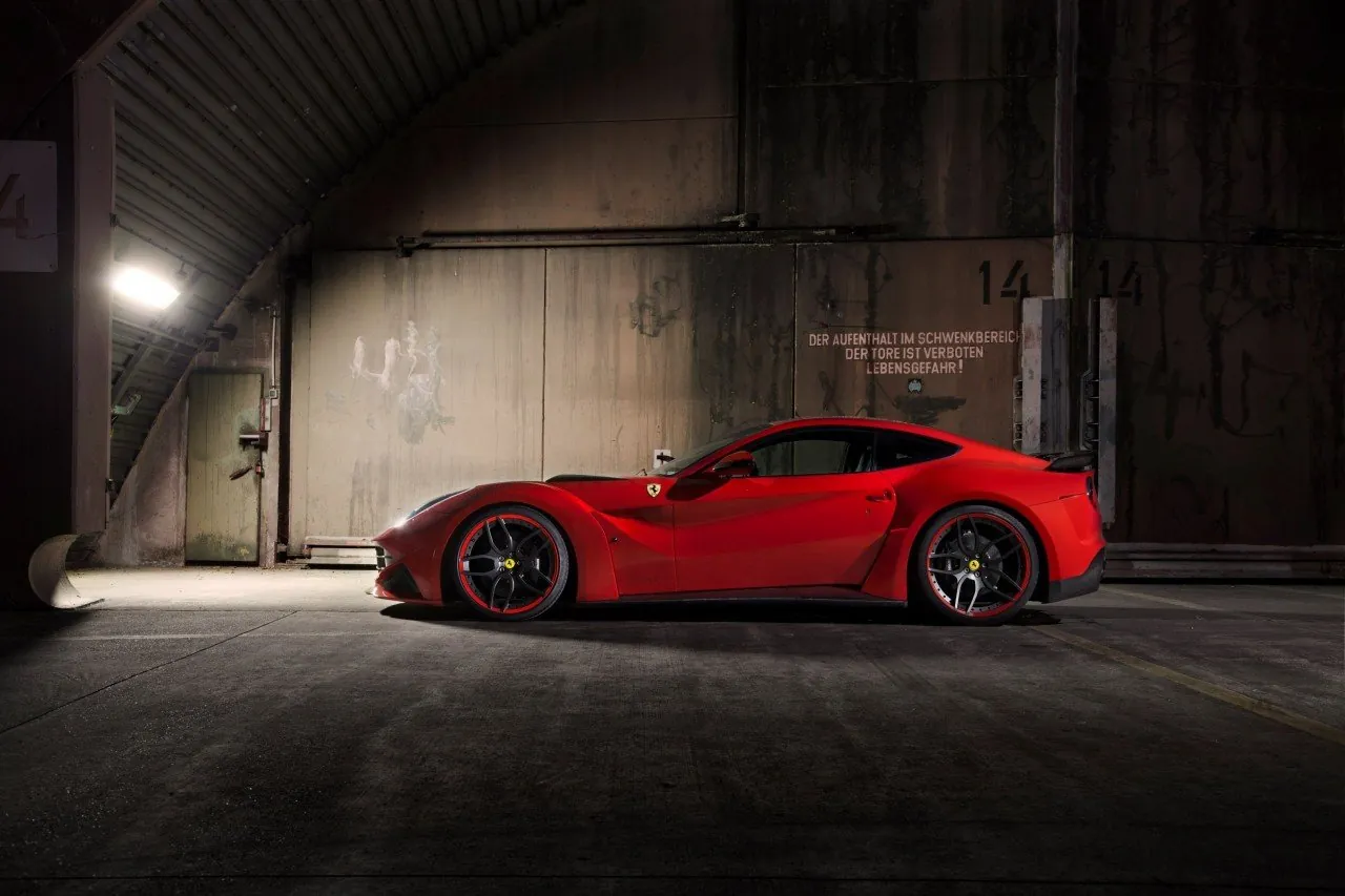 Red Novitec Ferrari F12 N-Largo side profile inside a concrete bunker