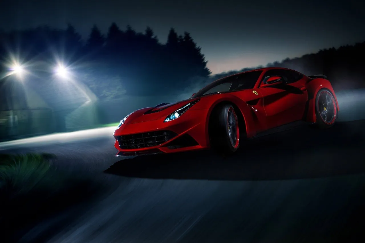 Red Novitec Ferrari F12 N-Largo driving at night, front three-quarter view