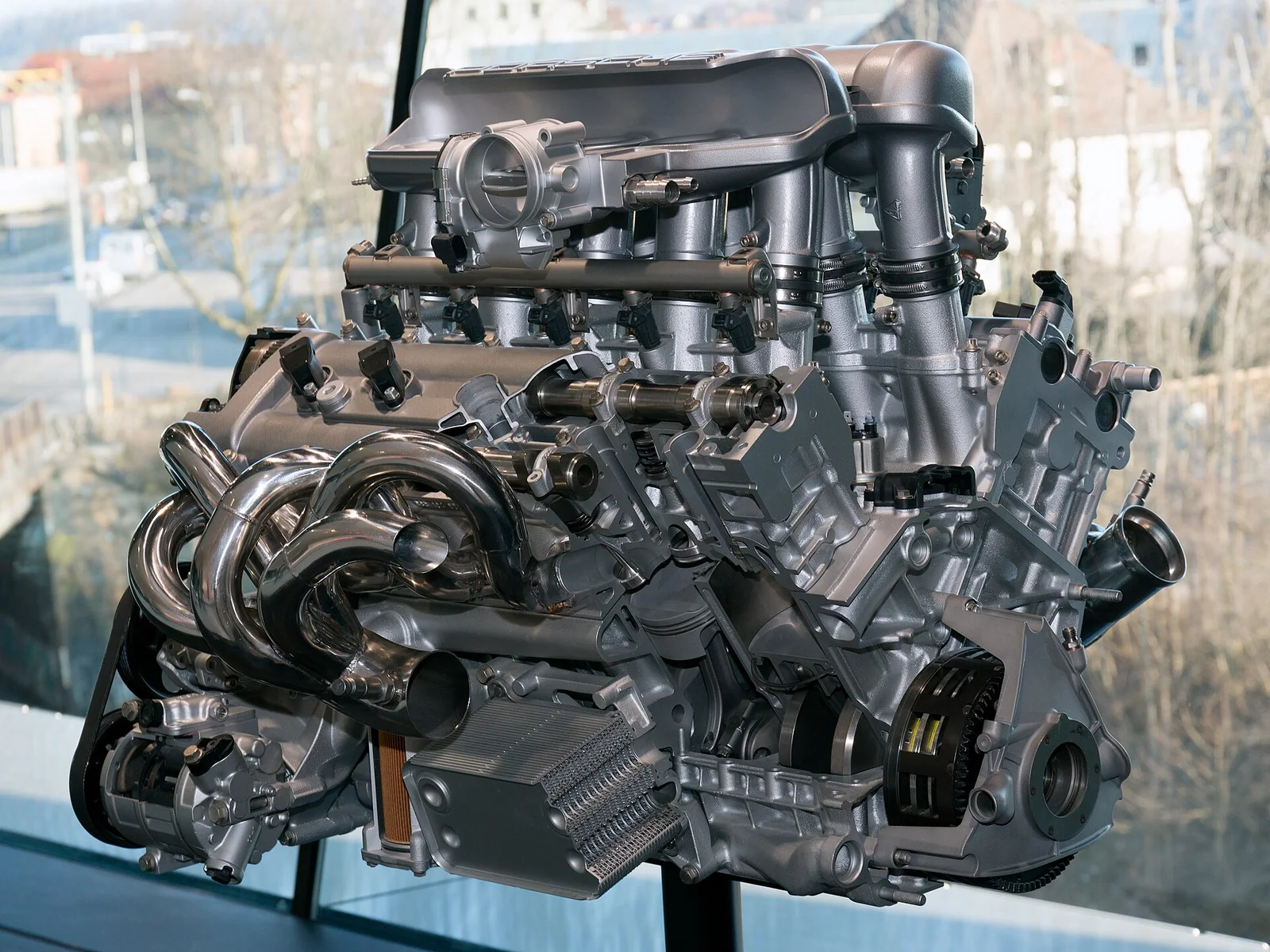 Cutaway of the Porsche Carrera GT 5.7-litre 68-degree V10 with individual throttle stacks, displayed at the Porsche Museum
