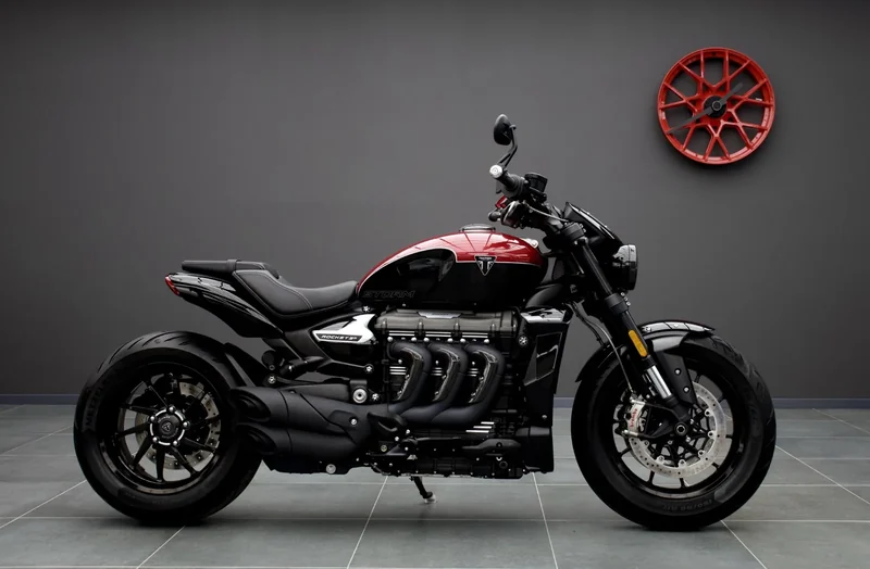 Triumph Rocket 3 R Storm in Korosi Red, side view in the Batman Garage