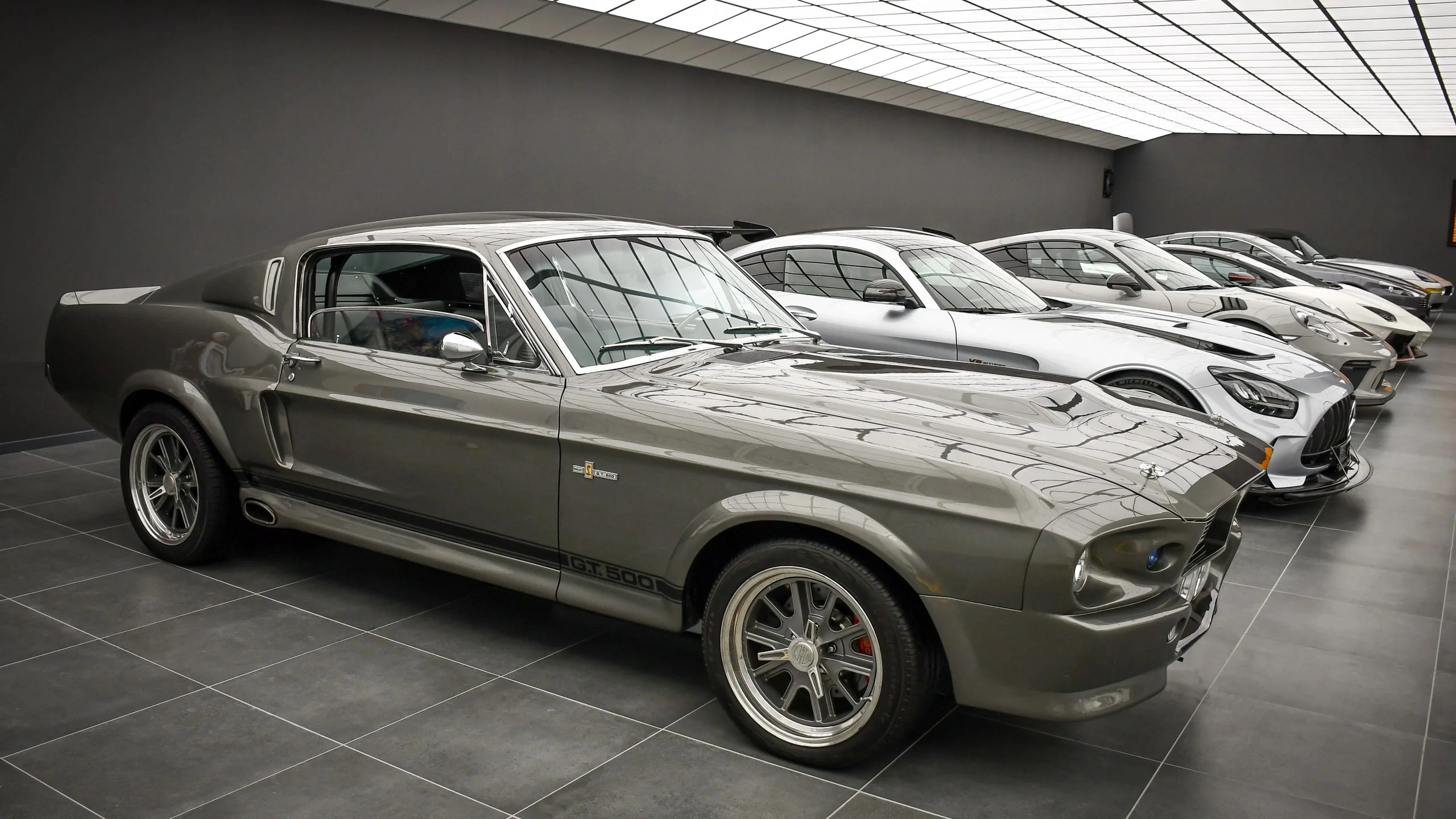 Ford Mustang Eleanor 1967 alongside Mercedes-AMG GT Black Series and the supercar lineup at Batman Garage