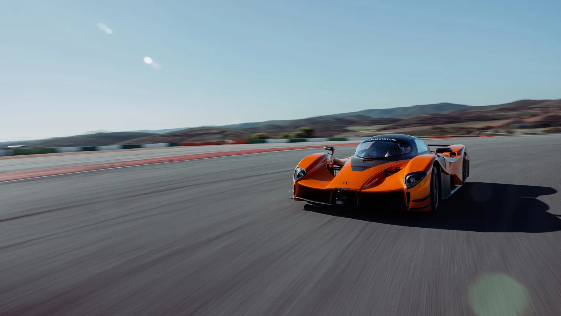 Orange Adamastor Furia hypercar driving on the Portimão circuit