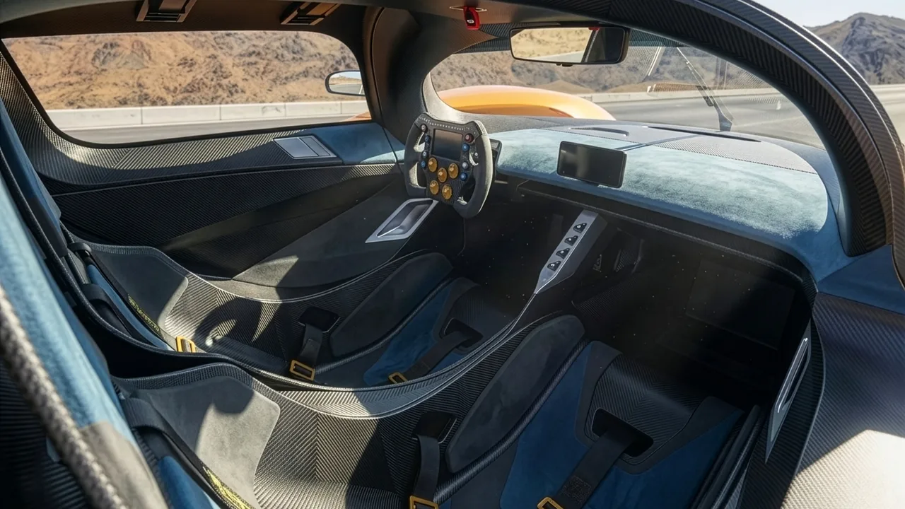 Adamastor Furia cockpit with carbon-fibre seats, racing harnesses and a race-style steering wheel