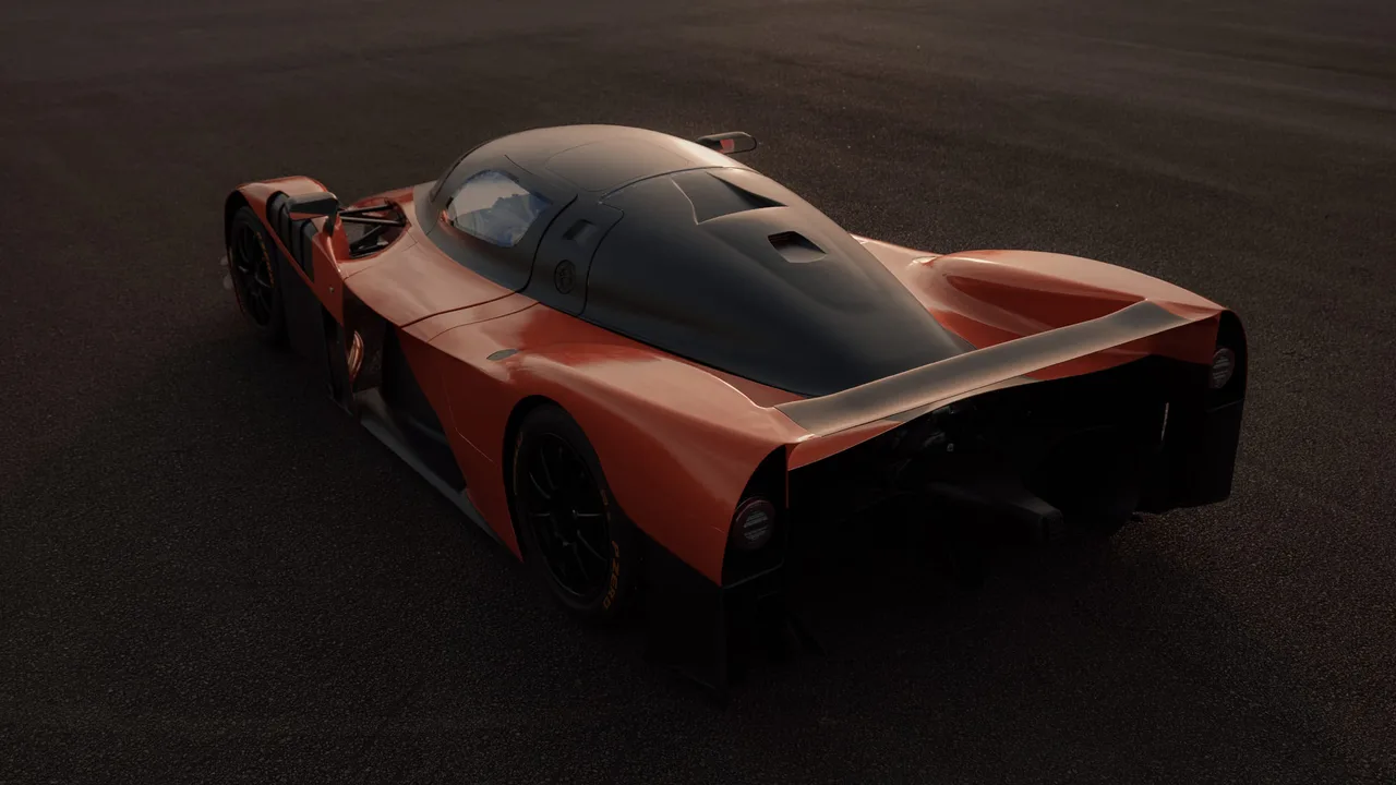 Orange and black Adamastor Furia from above and behind, showing the carbon cockpit canopy, rear wing and diffuser