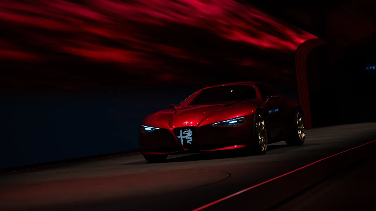 Alfa Romeo Cuorerosso front with illuminated Biscione grille and blue LED headlights in a dark studio