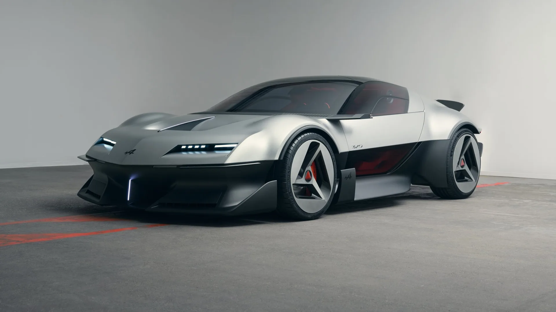 Silver Alpine A310 Vision concept front three-quarter view with slim headlights, S-duct bonnet and triangular wheels