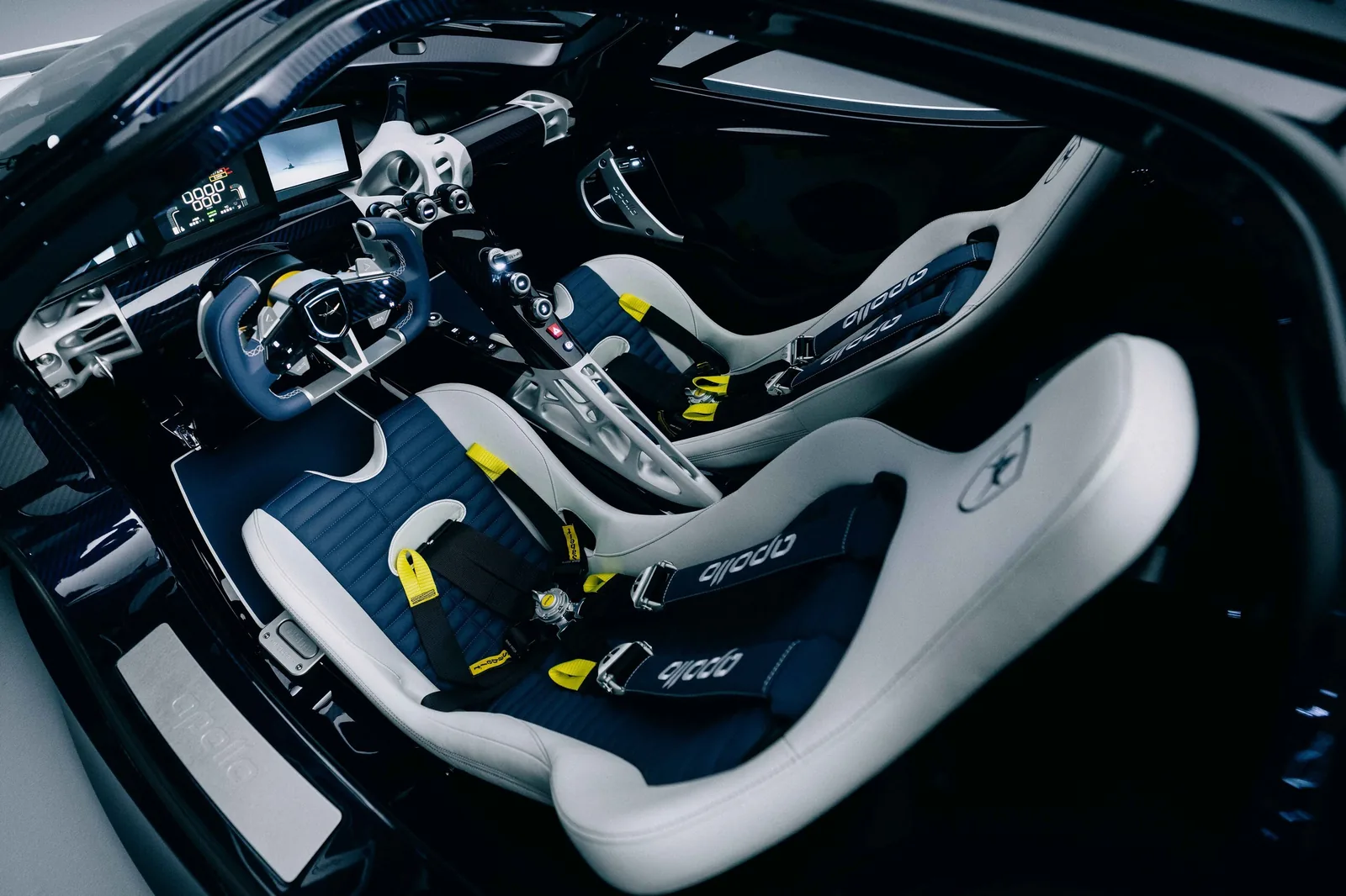 Apollo EVO Caribbean Dragon front detail — carbon-fibre splitter, LED headlights and central Apollo lettering on the Pearl White nose section
