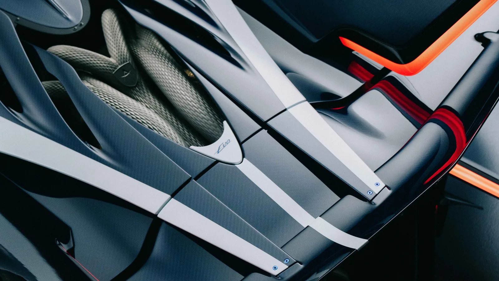 Apollo EVO Caribbean Dragon rear wing detail — swan-neck mounted carbon rear wing with Ocean Blue accents and structural monocoque exposed