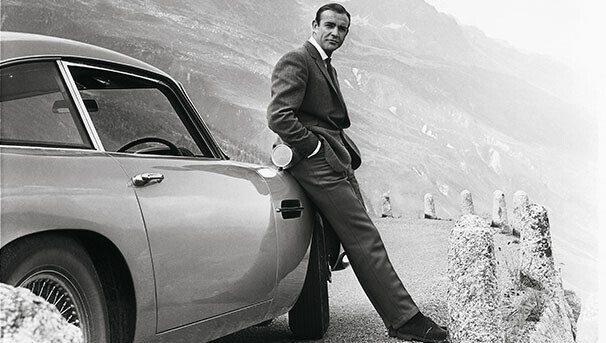 Sean Connery beside the Aston Martin DB5 during Goldfinger production