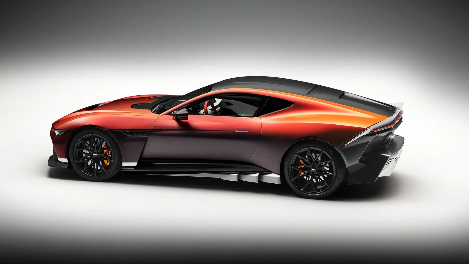 Aston Martin Valen rear three-quarter view showing camera housings replacing the rear window, integrated wing and carbon diffuser