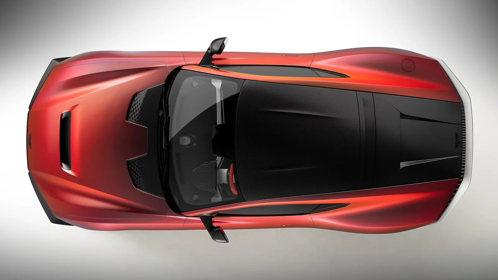 Aston Martin Valen top-down overhead view showing full silhouette, carbon roof and 21-inch magnesium wheels