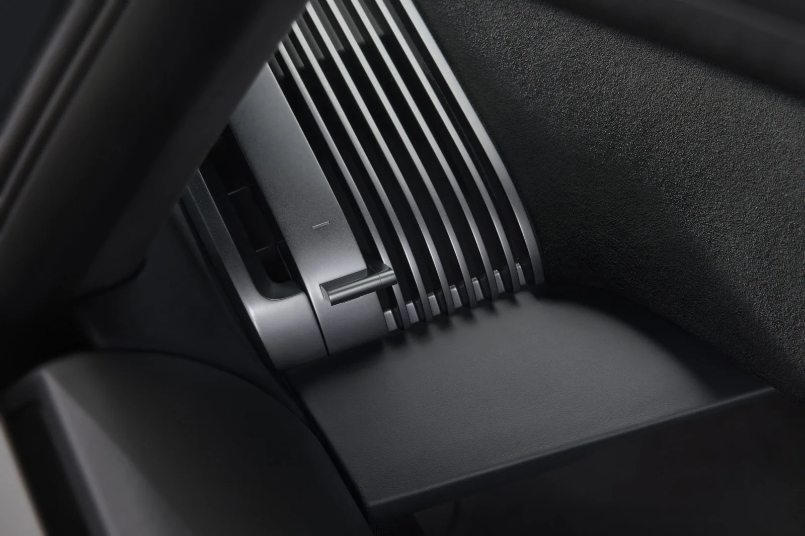 Audi Nuvolari 2027 interior detail — carbon-shell bucket seat with Alcantara, exposed carbon door card and metal accents