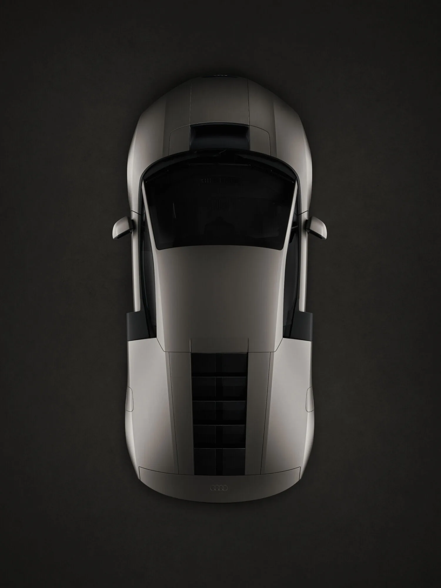 Audi Nuvolari 2027 top-down view — wide stance, monolithic carbon body, integrated rear wing in Titanium colour