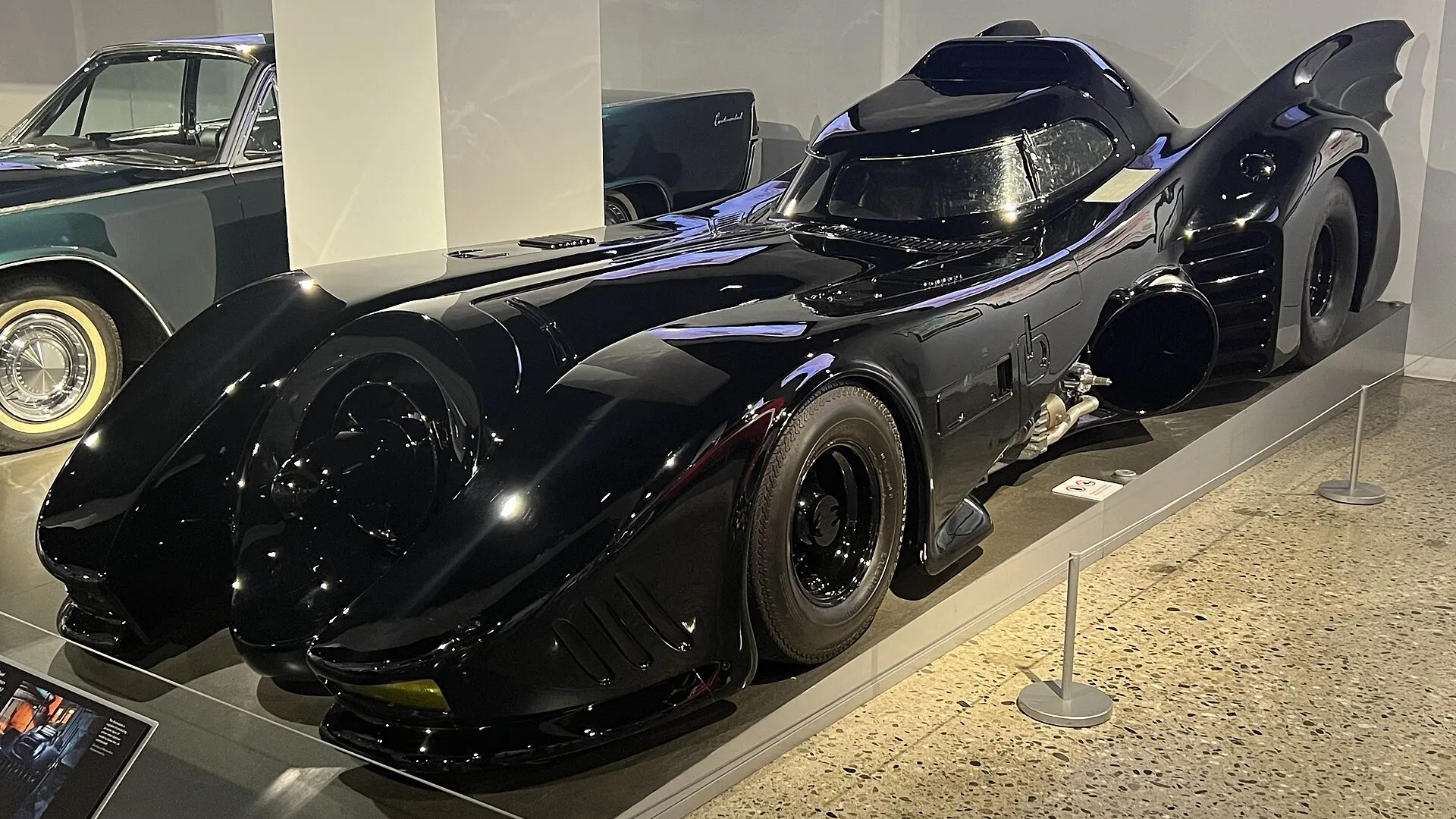 Gloss black Tim Burton Batmobile on display at the Petersen Automotive Museum, the same design as the Batman Returns hero car going to auction