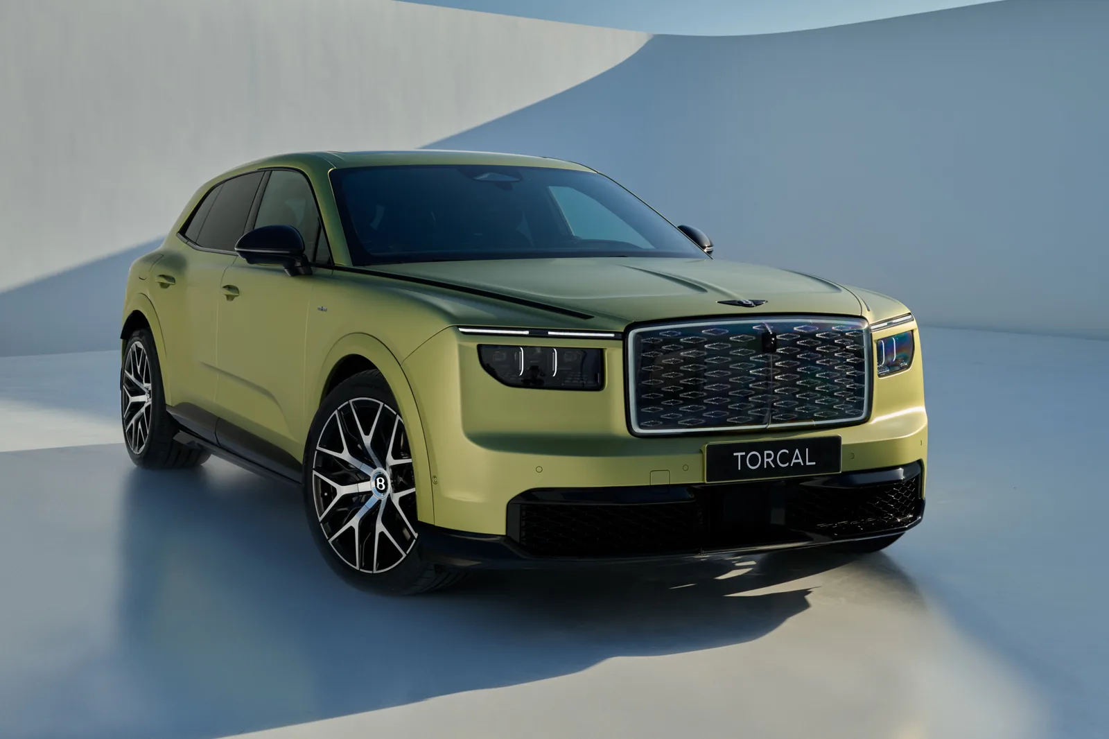 Bentley Torcal front three-quarter view with illuminated crystal grille and redesigned Flying B badge