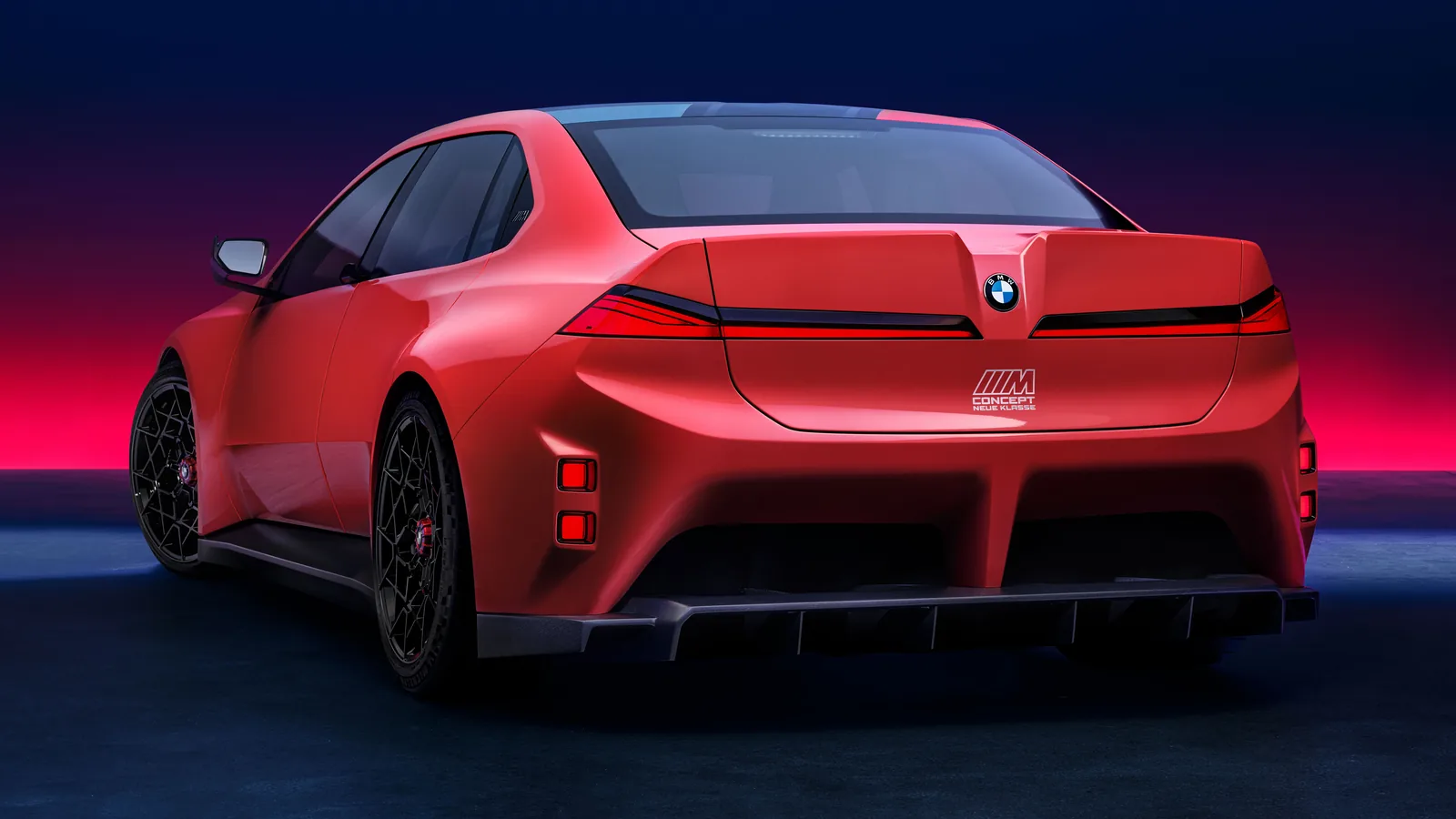 BMW M Concept Neue Klasse rear three-quarter showing ducktail spoiler and diffuser