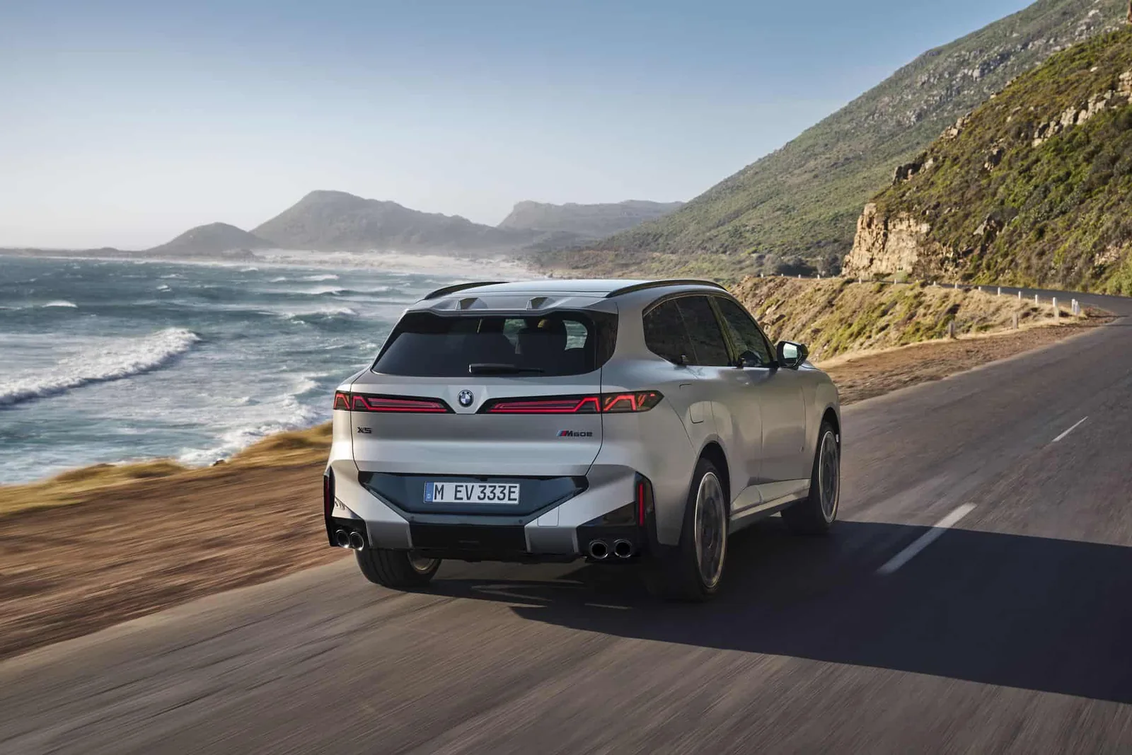 2027 BMW X5 (G65) side profile — smoother surfaces, BMW Winglets integrated into the beltline, 23-inch wheels available for the first time