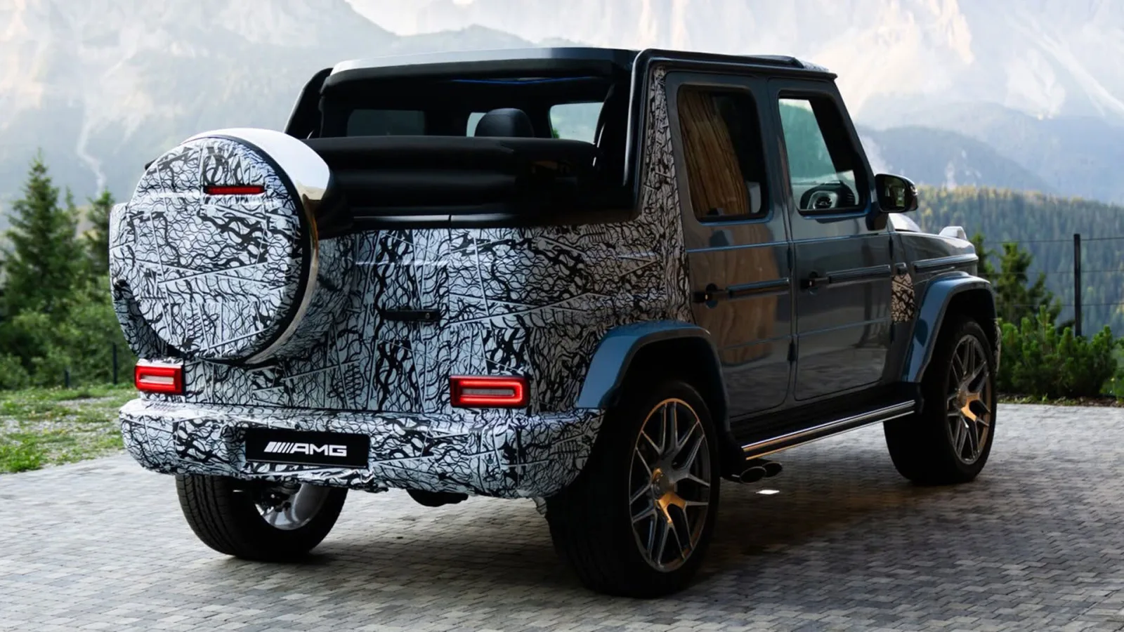 Mercedes-AMG G63 Cabriolet 2026 prototype in China Blue with light camouflage, retractable canvas soft top and 22-inch AMG wheels