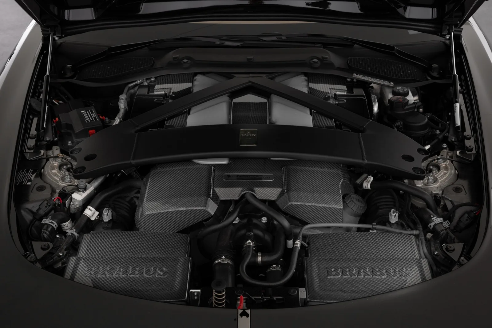 Brabus 5.2 litre twin-turbo V12 engine bay in the Bodo Cabriolet with carbon fibre covers and BRABUS lettering, producing 1,000 PS and 1,200 Nm
