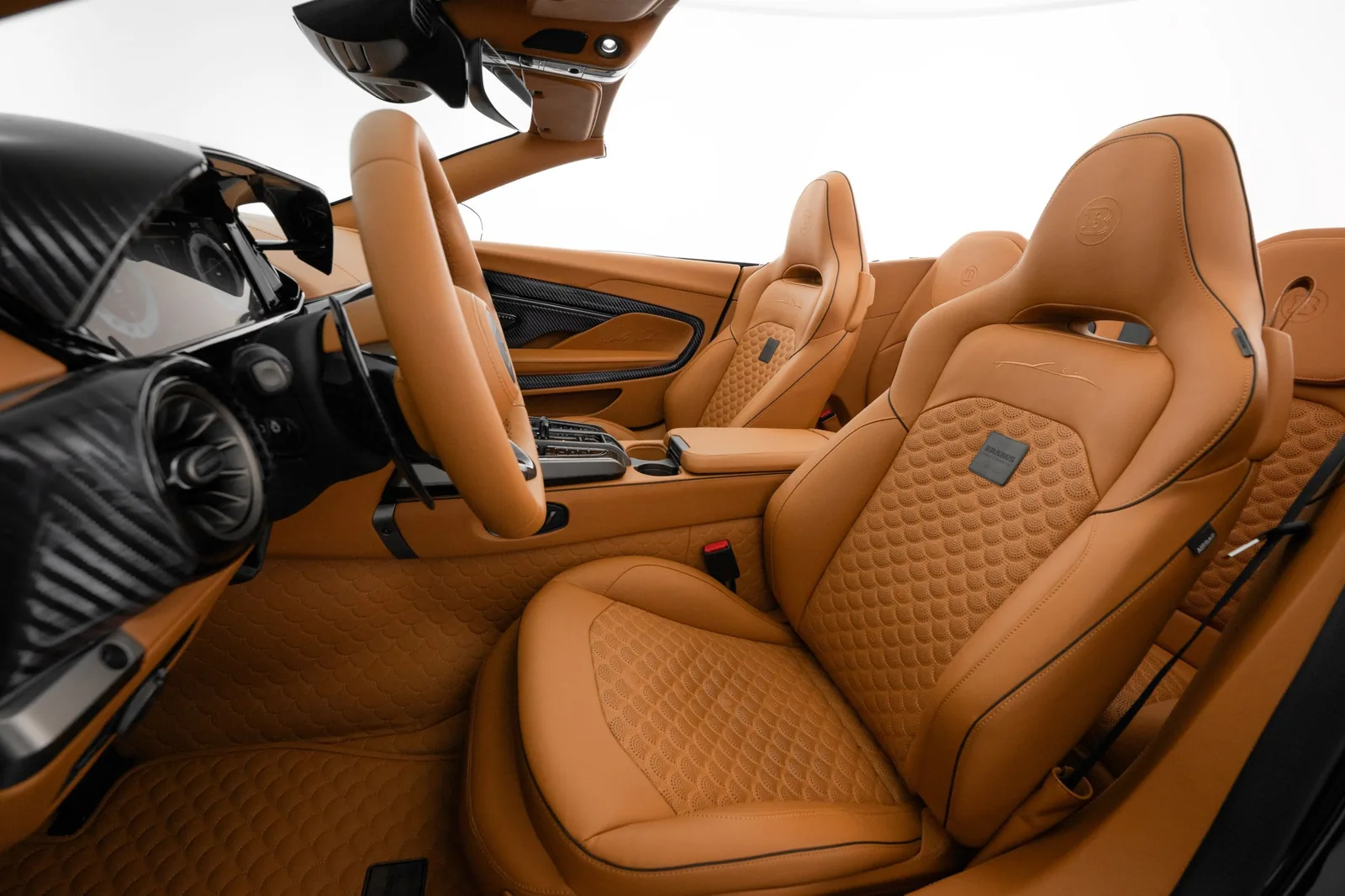 Brabus Bodo Cabriolet interior in Saddle Brown quilted leather with Brabus Masterpiece shell-quilting pattern, carbon dashboard trim and embroidered car silhouette on seat backs