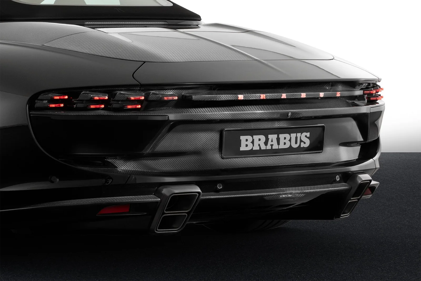Brabus Bodo Cabriolet rear detail showing full-width BRABUS-branded LED lightbar and quad titanium tailpipes