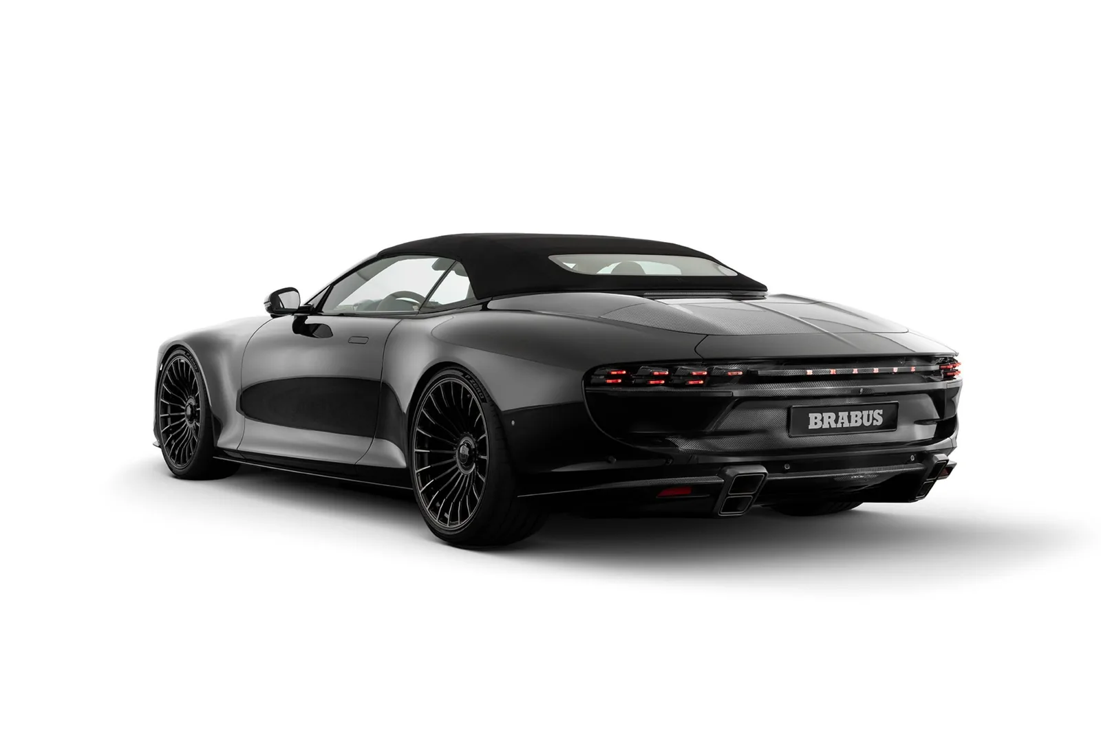 Brabus Bodo Cabriolet rear three-quarter view showing carbon rear spoiler, quad titanium exhaust and full-width BRABUS lightbar