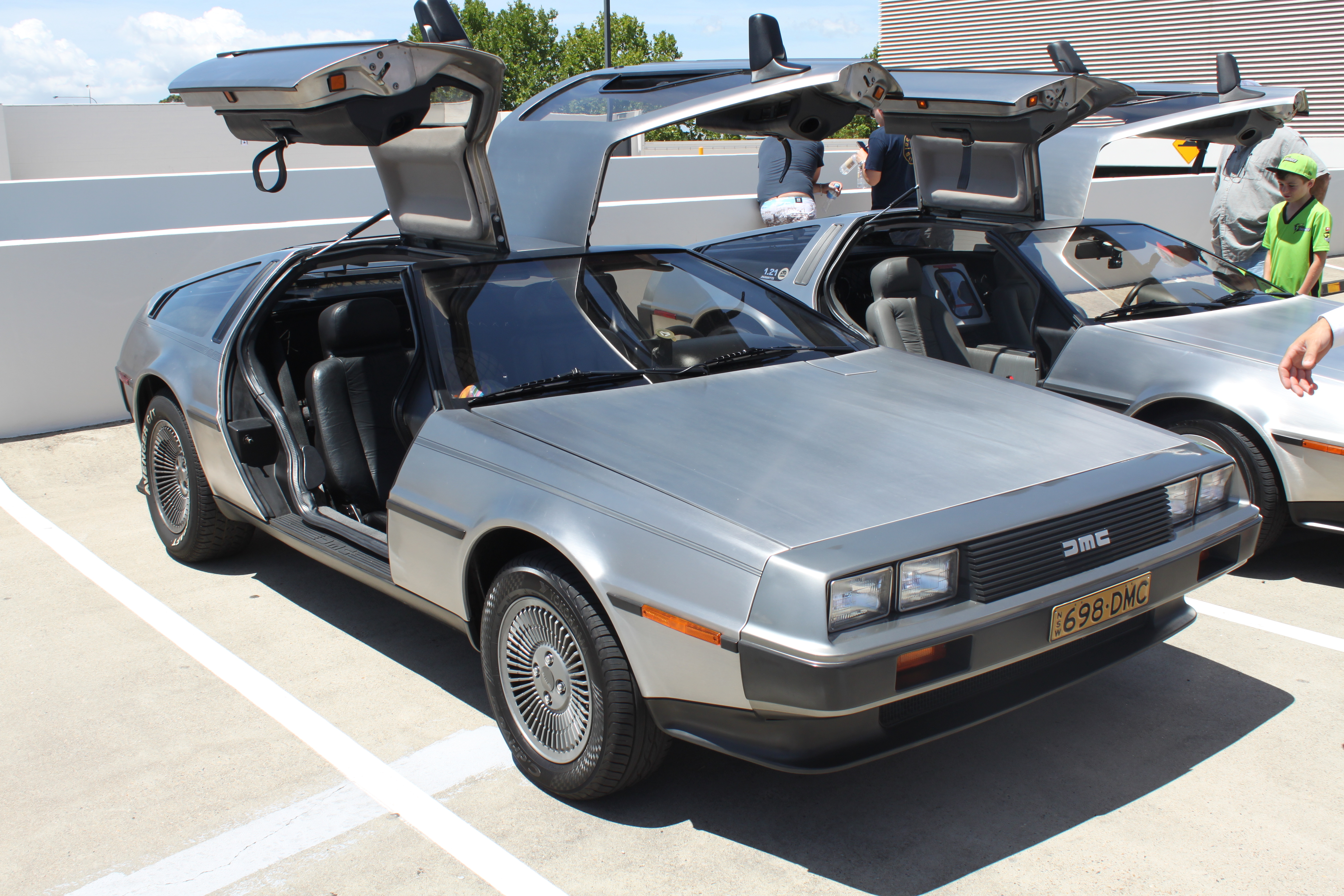 Stock stainless-steel DeLorean DMC-12 production coupe in side front view