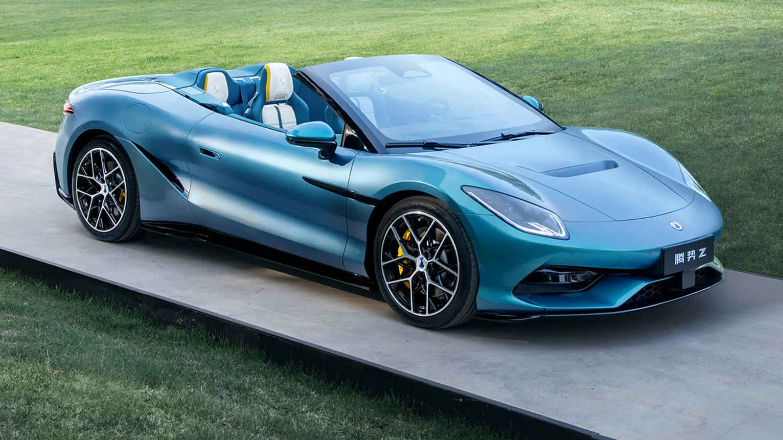 Denza Z Convertible side three-quarter view in Firenze green pearl on a press launch platform