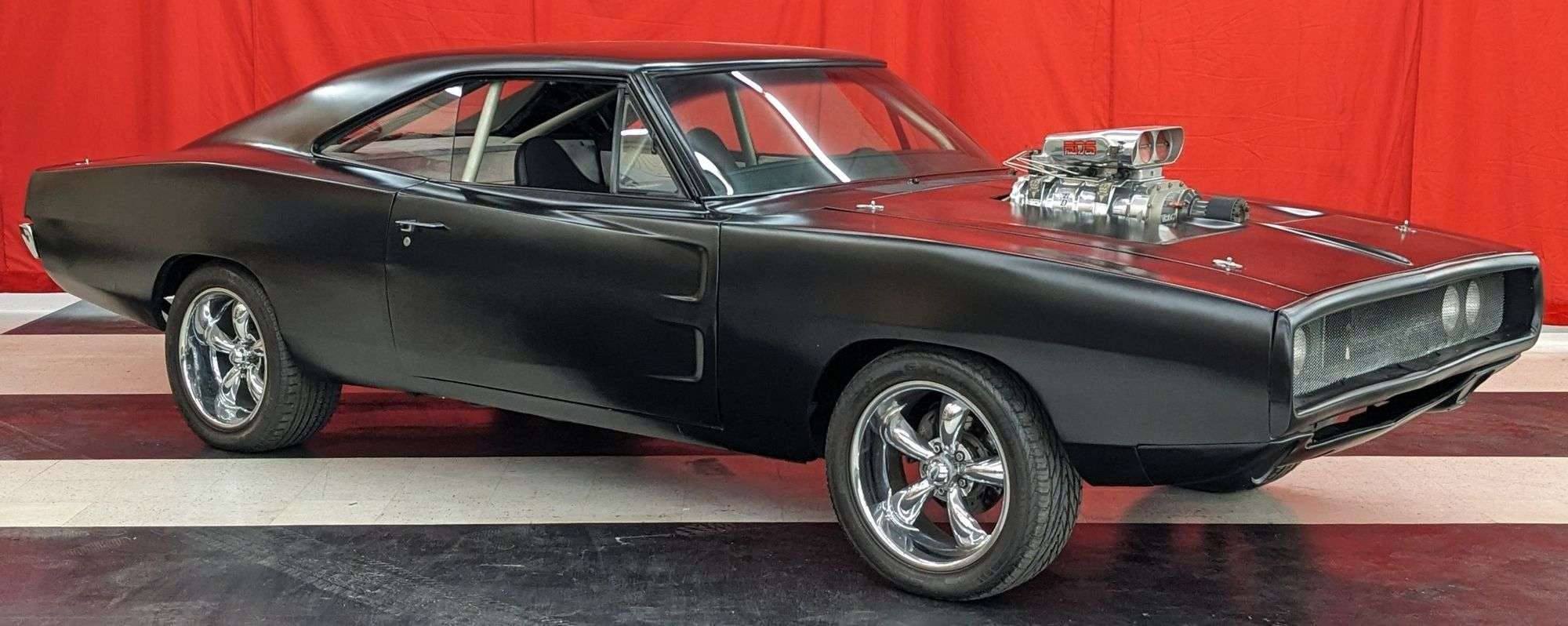 Black Dominic Toretto-style Dodge Charger displayed for sale at auction