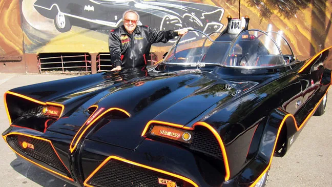 1966 Batmobile built by George Barris from the 1955 Lincoln Futura concept car — red bat-fin tail, double bubble canopy, twin red and white striping, made famous by Adam West's Batman TV series and 1966 feature film