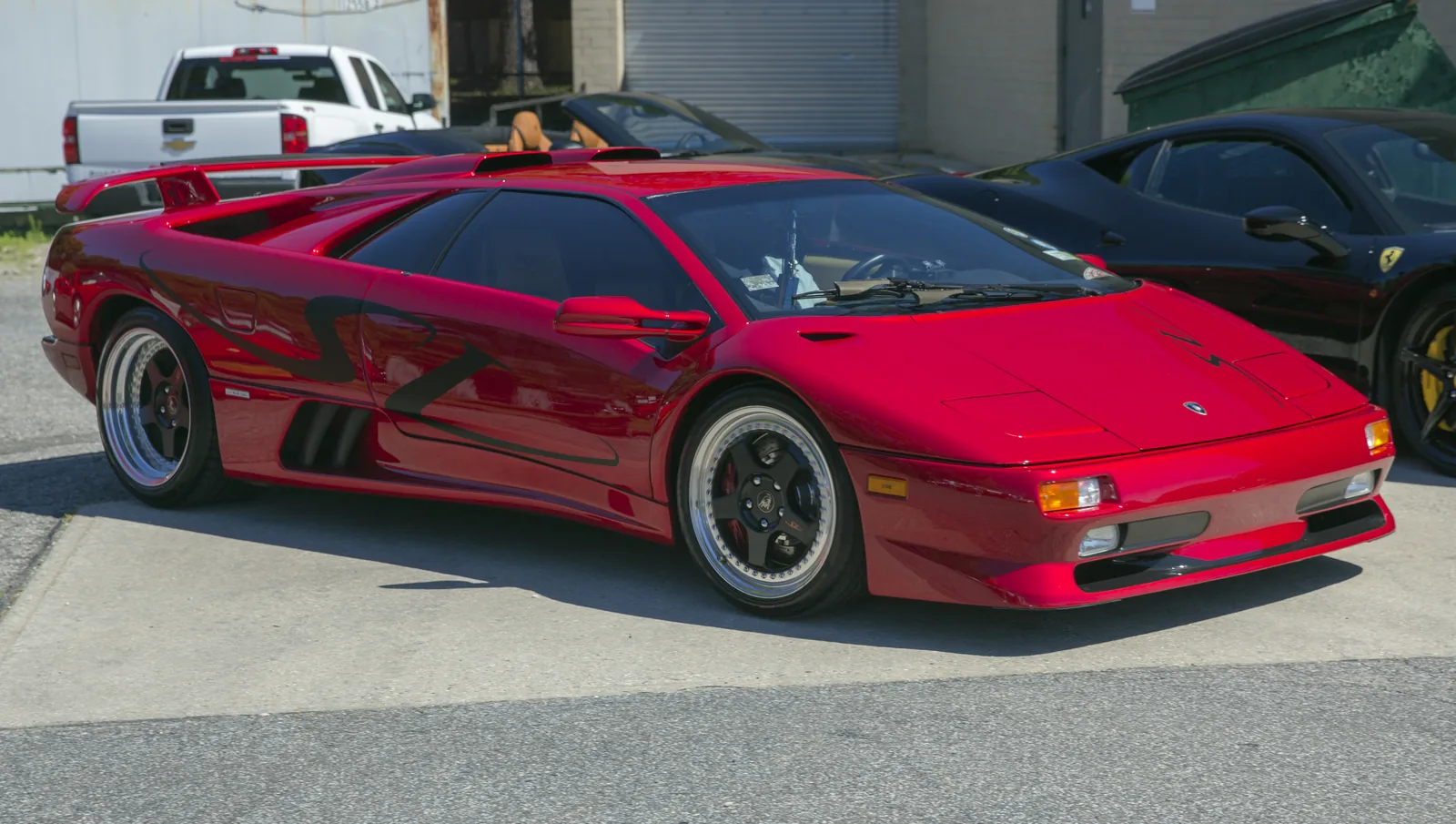 Lamborghini Diablo SV Monterey Edition number five in red, front right view showing the adjustable rear wing and black tail-lamp surrounds of the late Diablo SV