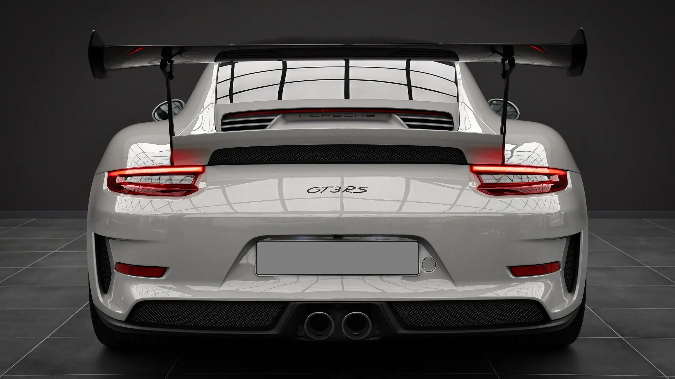 Porsche 911 GT3 RS 991.2 Weissach from the rear in the Batman Garage studio, swan-neck wing and GT3 RS script on the engine lid