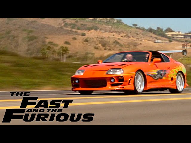 Brian O’Conner’s orange Supra driving in a The Fast and the Furious film montage
