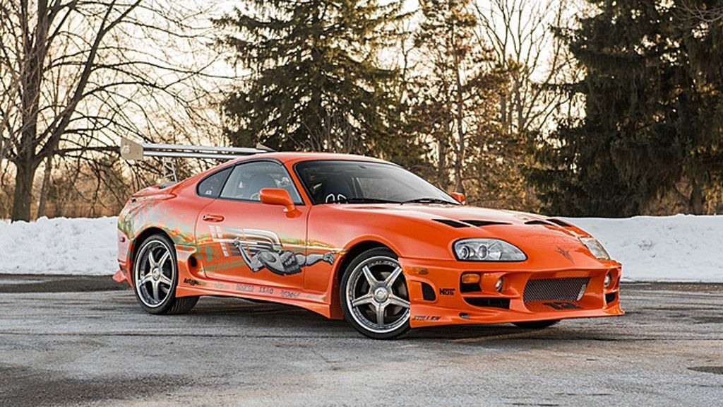 Orange Toyota Supra photographed at night in Fast and Furious style