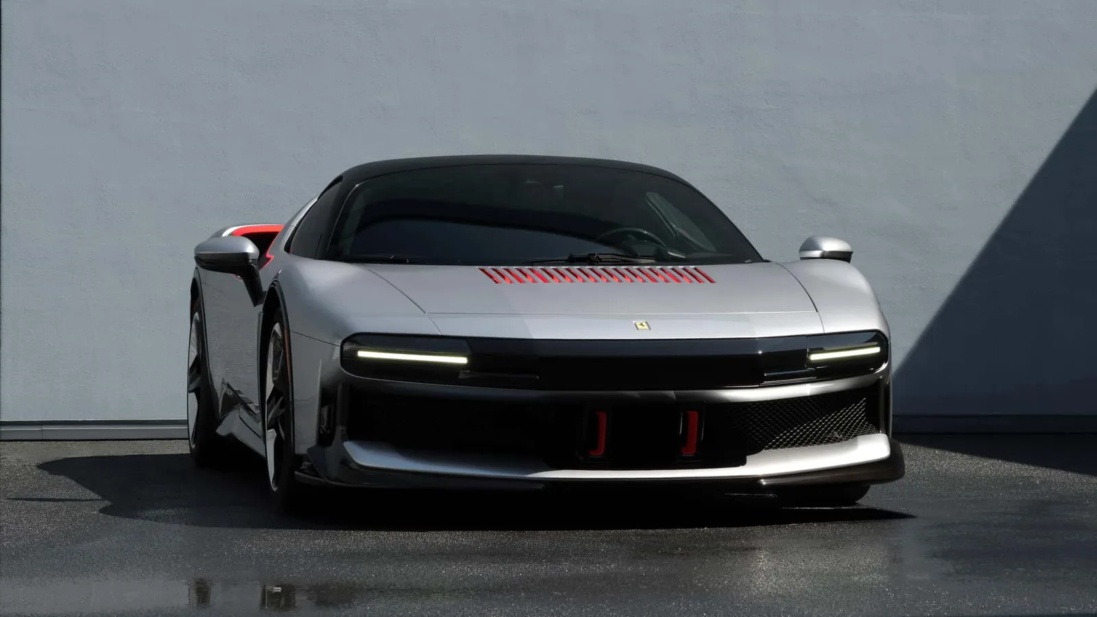 Ferrari CZ26 front view showing the full-width grille, ultra-slim hidden LED headlights and red-accented intakes
