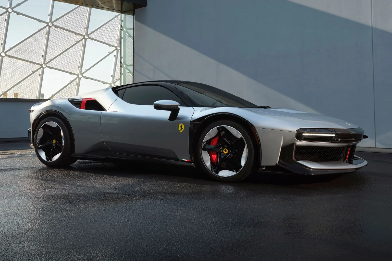 Ferrari CZ26 rear three-quarter view showing the cantilevered full-width taillight bar and enlarged rear diffuser