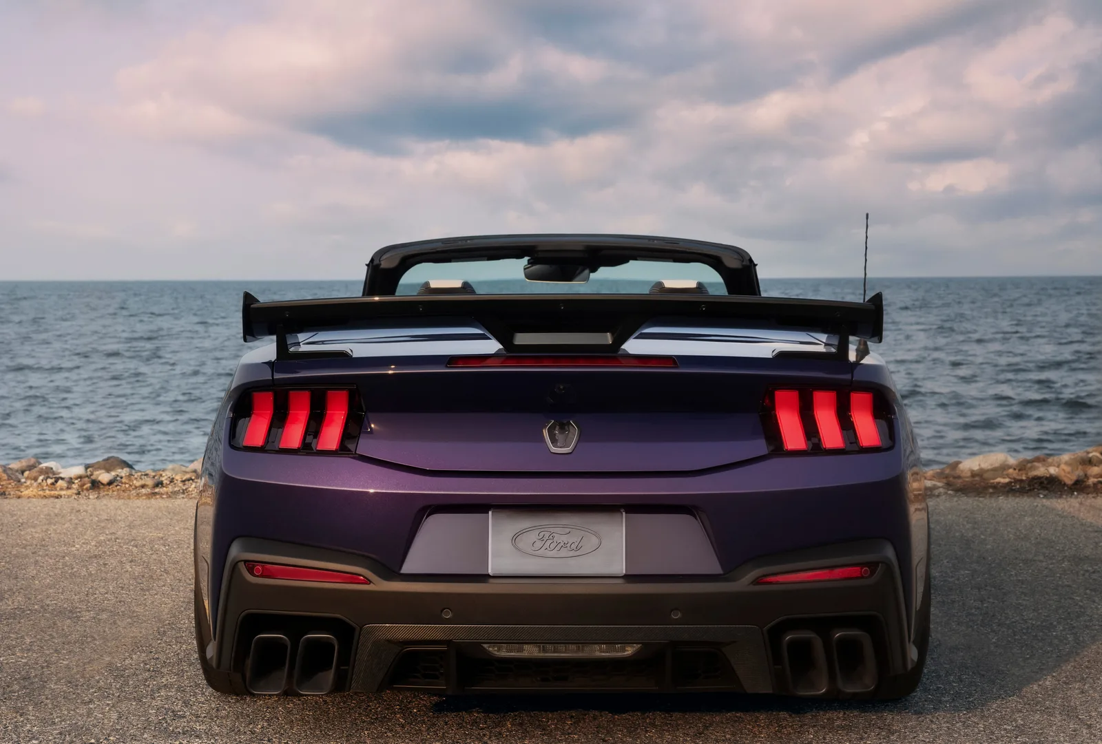 2027 Ford Mustang Dark Horse SC Convertible direct rear view in Precision Purple showing full-width lightbar, rear diffuser and quad-tip exhaust