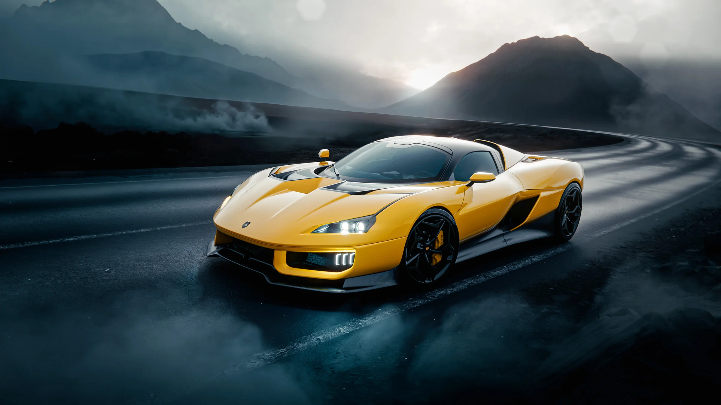 Giamaro Krafla in yellow on a mountain road — front view showing aggressive aerodynamic design